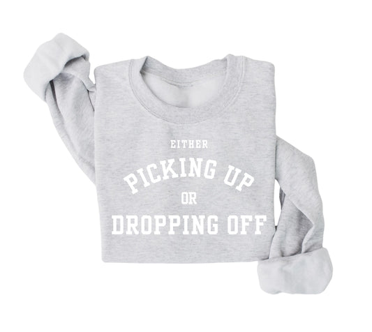 Either picking up or dropping off sweatshirt